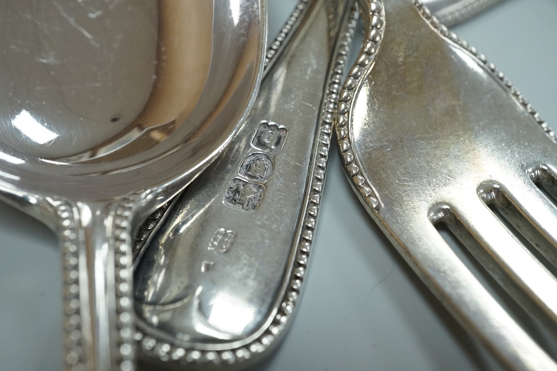 A harlequin part canteen of late Victorian and Edwardian silver beaded Old English pattern flatware, various dates and makers, comprising thirty items, 55.8oz.